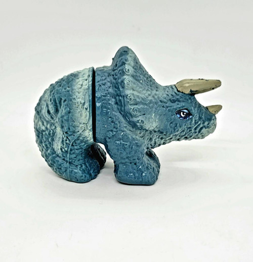 Jurassic Park 1997 UCS & Amblin Triceratops Toy Figure, detailed blue and gray dinosaur toy with realistic textured skin and painted eyes.