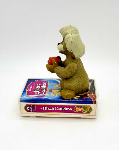 McDonald's Happy Meal Toy of The Black Cauldron from the 1998 Disney Video Favorites line.  The Black Cauldron was number 5 in the set and features Gurgi on top of the VHS version of his movie.  The movies can connect to form a train of VHS movies.