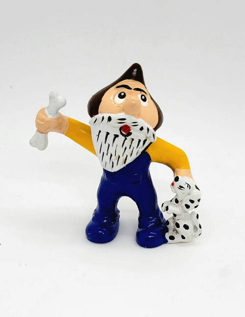Hershey's 1984 Hershkins Guy With Puppy PVC Toy Figure, animated character with a bushy beard, wearing a yellow shirt, blue pants, holding a bone, with a Dalmatian puppy.
