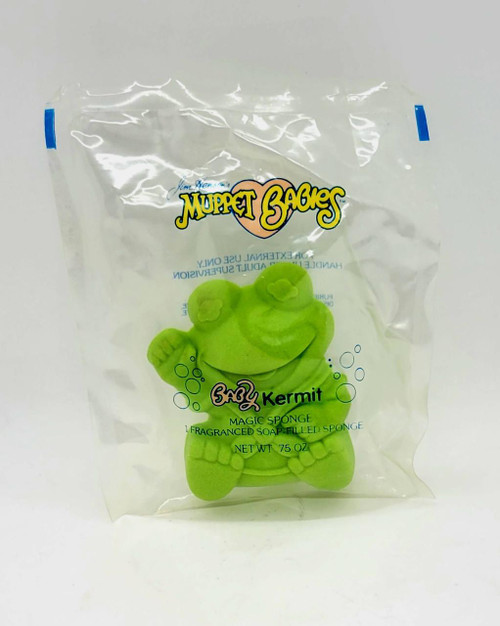 AVON 1986 Muppet Babies Baby Kermit Magic Sponge, a green frog-shaped sponge with a smiling face inside a clear plastic bag.