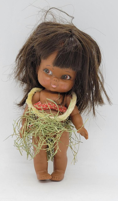 Shiba Japan 7-inch Hula Doll, vintage doll with brown hair, hula skirt made of grass, and tropical-themed outfit.