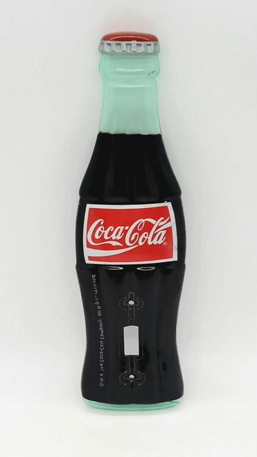 Coca-Cola 1994 Plastic Bottle Light Switch Cover, decorative light switch cover designed to look like a Coca-Cola bottle.