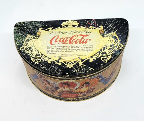 Coca-Cola The Drink Of All The Year Half Circle Tin, vintage decorative Coca-Cola collectible tin with ornate gold design and images of women holding umbrellas.