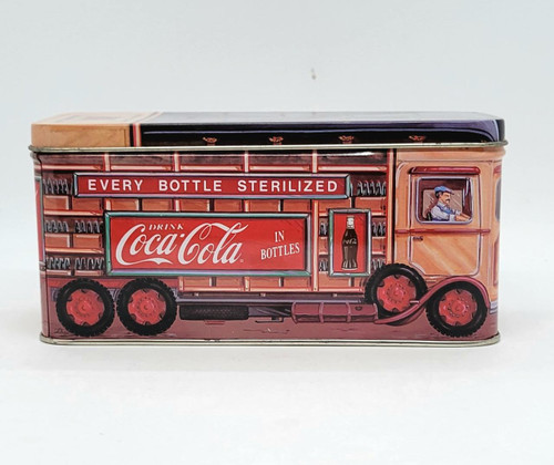 Coca-Cola 1992 Delivery Truck Collectors Tin with Lid, vintage metal tin featuring a printed illustration of a Coca-Cola delivery truck from 1992, with colorful branding and a driver, designed for collectors.