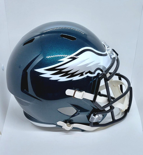 Riddell NFL Philadelphia Eagles Full Size Replica Speed Football Helmet, a blue and silver football helmet with a white eagle wing logo and black facemask.