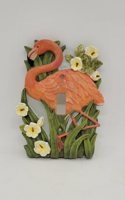 Unbranded Pink Flamingo 1 Toggle Resin Wall Plate, decorative pink flamingo design with green leaves and yellow flowers on a white background.