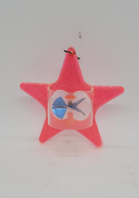 Unknown Vintage Pink Plastic Star Spinner Christmas Ornament, a pink plastic star-shaped ornament with a central spinning propeller and glitter accents.