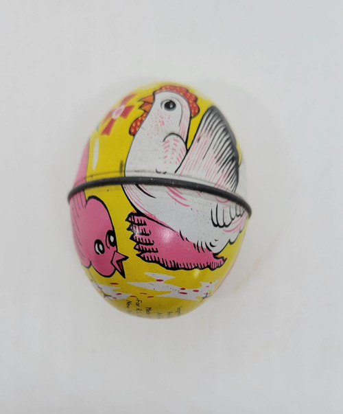 R. L. Alberts & Son Vintage Yellow Tin Egg With Hen & Chicks, colorful tin egg with a hen and a chick on it.