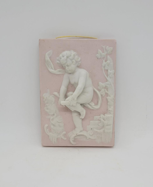 Arnart Creations Pink Bisque Cherub Plaque or Wall Hanging, decorative pink bisque ceramic plaque featuring a cherub with detailed sculpting.