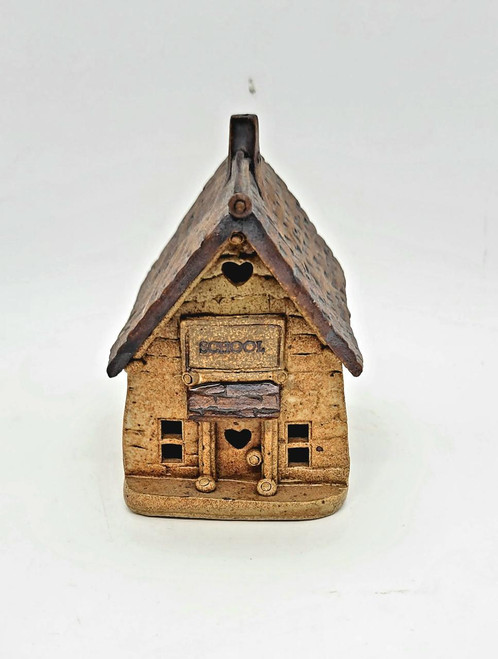 Windy Meadows Pottery School House Clay House, handcrafted miniature ceramic building modeled as a school with detailed textured exterior and small heart-shaped windows.