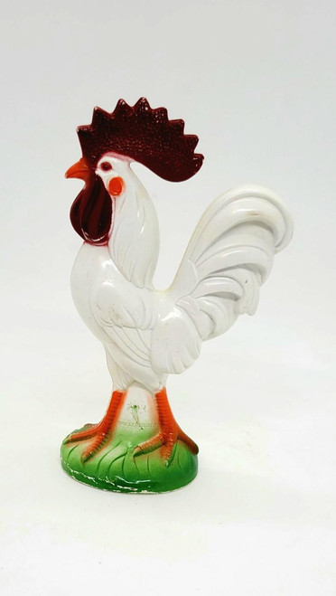 Knickerbocker Vintage Knickerbocker Hard Plastic Rooster, vintage white ceramic rooster figurine with red and brown comb and wattles, orange beak and legs, standing on a green base.