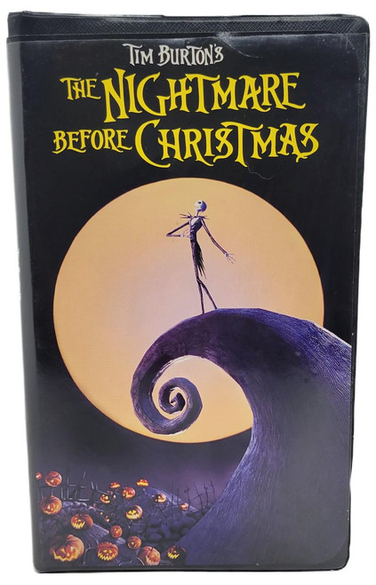 Touchstone Home Video Tim Burton's The Nightmare Before Christmas VHS, vintage VHS tape cover featuring Jack Skellington on the spiral hill with a full moon background and glowing pumpkins at the bottom.