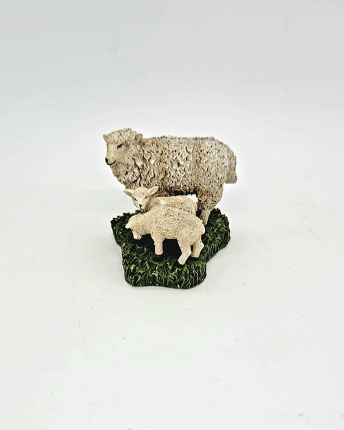 Williamsburg Collectibles of a sheep with her two lambs from 2002 that stands 1.25" tall with base.  These resin figures were made in China for Lang & Wise, Ltd.