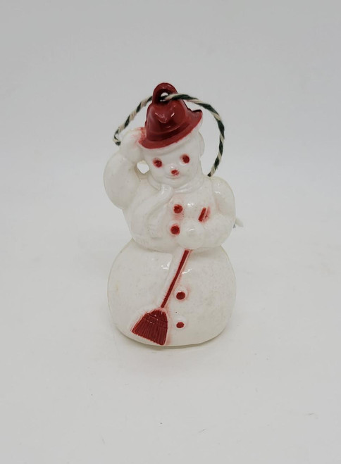 Unknown Vintage Plastic Snowman Christmas Ornament, white snowman figure with red scarf, red buttons, red hat, and broom detail, decorative holiday ornament.