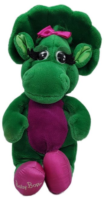 Barney and Friends 1992 16" Baby Bop Stuffed Animal, a plush green toy with large eyes, pink bow, purple belly, and pink shoes with 'Baby Bop' embroidery.