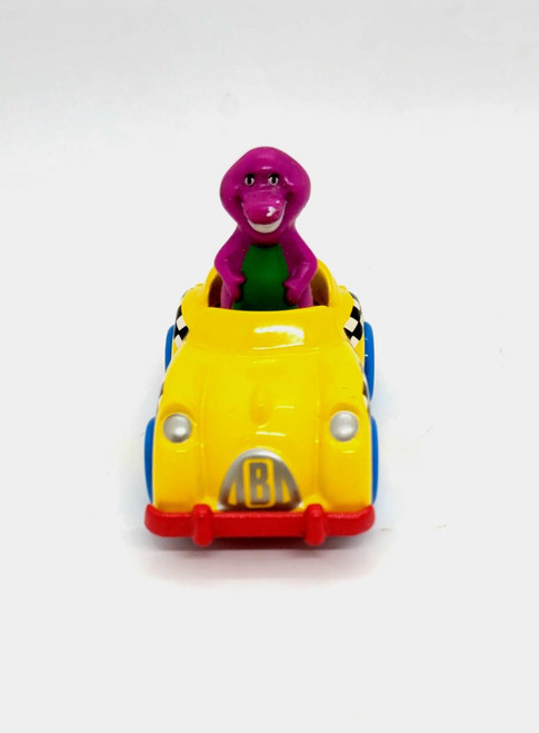 Kid Dimension, Inc. Barney and Friends 1993 Barney Driving Taxi Cab Diecast, yellow taxi cab with Barney character figure inside.