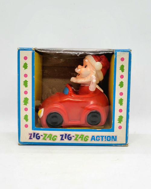 YULETIDE Enterprise, Inc. Vintage Yuletide Friction Powered Zig-Zag Action Santa Claus in Car Made in Japan, decorative vintage Christmas toy with Santa in a red car.