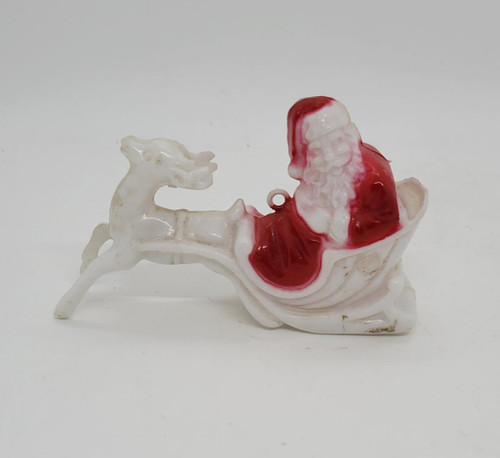 Irwin Vintage Hard Plastic Santa with Reindeer Candy Container Ornament, Christmas holiday decoration featuring Santa Claus riding in a sleigh with a reindeer.
