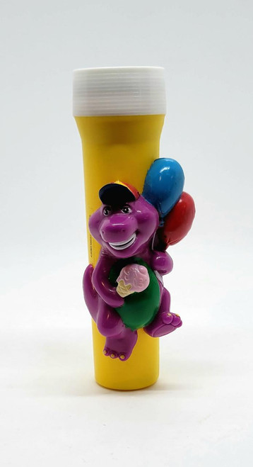 Barney and Friends 1993 Barney Flashlight, colorful plastic flashlight featuring a cheerful Barney figure holding a cookie with balloons in the background.