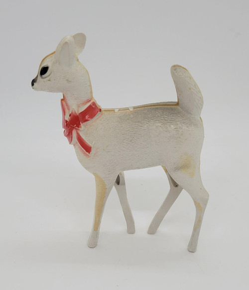 Unknown Vintage Hard Plastic Reindeer Figure, a small white reindeer figurine with a red ribbon around its neck, featuring black eyes and a textured surface.