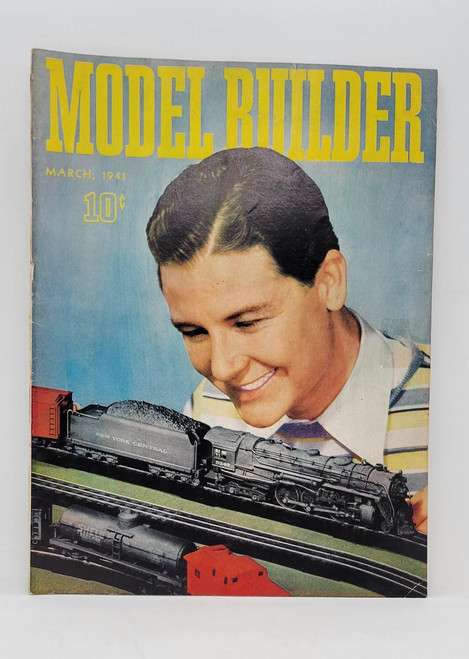 Lionel Trains Model Builder Vol 5, No.26 March 1941 magazine cover featuring a smiling young boy looking at a model train.