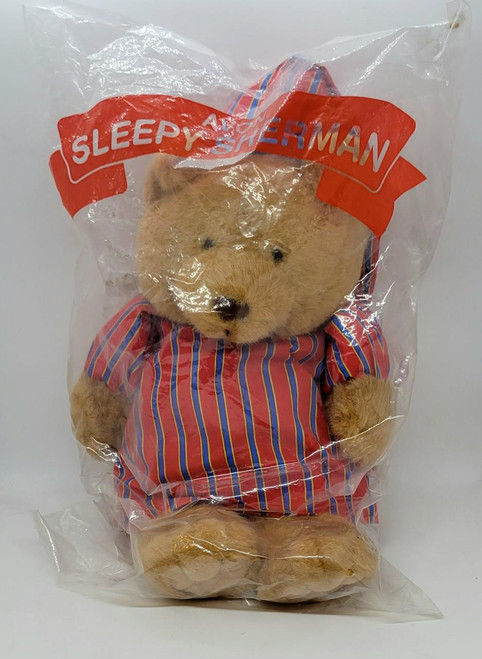AVON Sleepy Sherman 14-inch Musical Teddy Bear, plush teddy bear in striped pajamas inside clear plastic packaging.