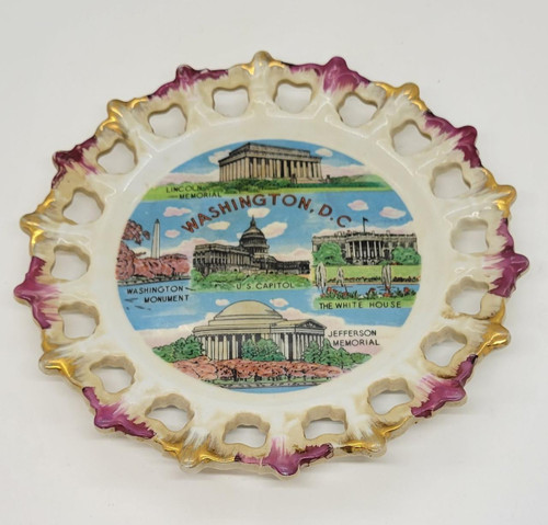 Unknown Washington D.C. 8-inch Decorative Wall Hanging Plate, featuring illustrated landmarks of Washington D.C. including the U.S. Capitol, Lincoln Memorial, White House, Washington Monument, and Jefferson Memorial, with a decorative purple and gold scalloped border.