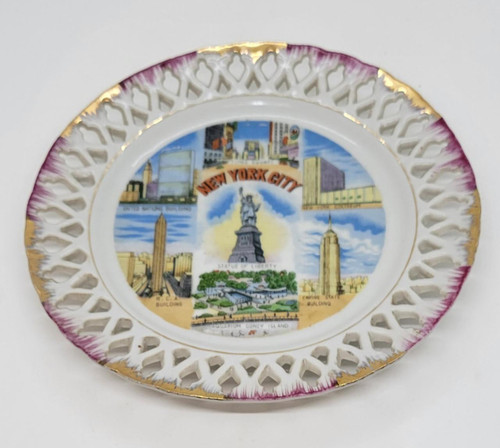 Unknown New York City 8" Decorative Wall Hanging Plate, featuring iconic NYC landmarks and cityscape illustrations with a decorative white and purple rim with gold accents.