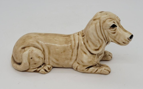 Unknown Vintage Ceramic Basset Hound Laying Down Figurine, made in Japan, beige and brown detailed ceramic dog sculpture.
