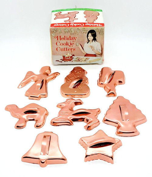 Comar Products Vintage Copper Christmas Holiday Cookie Cutters, set of metal cookie cutters shaped like holiday-themed figures and objects, made in Hong Kong.