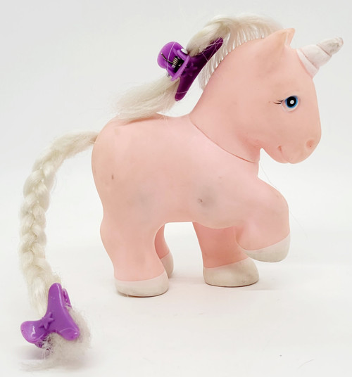 Vintage 1982 Remco Pretty Pets toy figure of a pink and white Happy Unicorn.  The Pretty Pets lines were similar to My Little Pony that offered hair to be braided or combed.