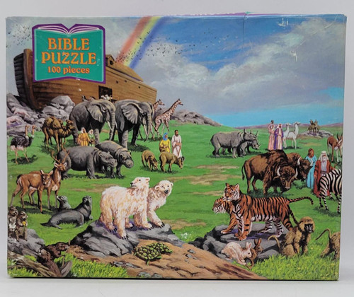 Bible Puzzle 100 Pieces - Noah's Ark 2, colorful illustration of Noah's Ark with various animals and people on lush green grass under a partly cloudy sky.