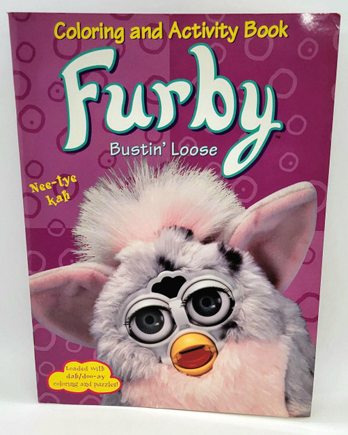 Tiger Electronics Furby Bustin' Loose Coloring and Activity Book - 1999, featuring a colorful cover with a furry Furby toy with large eyes, big ears, and a robot-like mouth, on a pink background with circles.