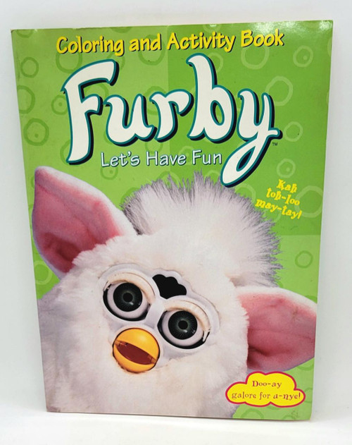 Tiger Electronics Furby Let's Have Fun Coloring and Activity Book - 1999, close-up of a Furby's face wearing glasses and with large eyes, pink ears, and a yellow beak, on a bright green background with playful text and graphics.