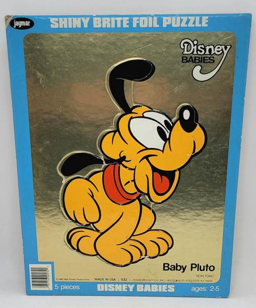 Jaymar 1985 Disney Babies Shiny Brite Foil Puzzle featuring Baby Pluto, a colorful illustration of Mickey Mouse's puppy character on metallic gold background.