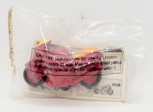 Wendy's Kids' Meal Toy 1994 Cybercycles - Red, small pink and yellow toy motorcycle inside clear plastic packaging with caution warning label