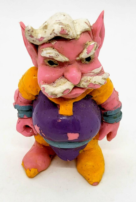 Galoob Vintage 1983 Galoob Blackstar Balker Trobbit PVC Toy Figure, colorful vintage collectible figurine with pink skin, purple outfit, yellow shoes, and distinct facial features.
