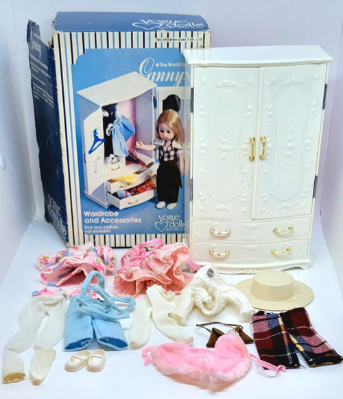 Vogue Dolls The World of Ginny Wardrobe and Accessories Playset, includes a white wardrobe, assorted doll clothes, shoes, hat, and accessories for fashion play.