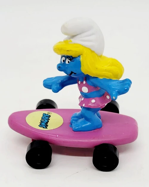Smurfs Hardees Kids Meal Toy 1996, Smurfette on purple skateboard with yellow hair and white hat
