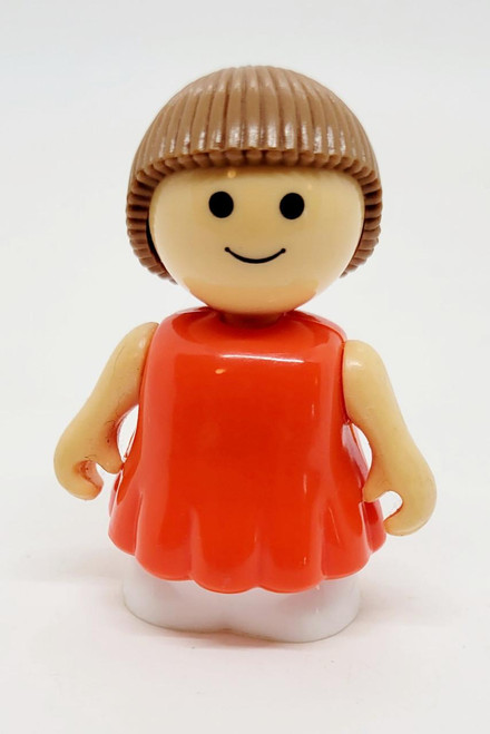Playmates Li'l Playmates - Female with Orange Dress and Brown Hair, toy figure with smiling face and short hairstyle.