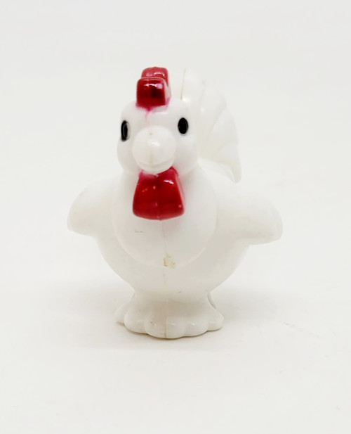 Playmates 1985 Li'l Playmates Farm Play Set - Chicken, small white plastic chicken figurine with red comb and wattles, and black eyes, on a plain white background.