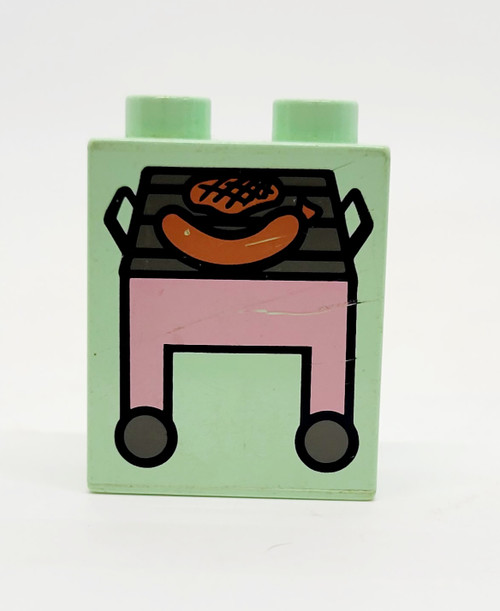 LEGO Duplo Brick 1 x 2 x 2 with Pink Grill and Hot Dog Pattern, pink and black printed design on a light green LEGO brick.