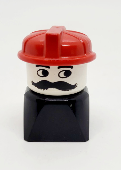 Lego LEGO Duplo 2x2x2 Male on Black Base with Mustache Red Hat (Firefighter) Brick Figure, toy firefighter figure with red helmet, white face with mustache, black torso, and black base.