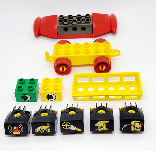 LEGO DUPLO Brick Lot of 10, including tools, car base, wings, with various colorful bricks and wheels for building kids' playsets.