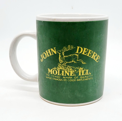 John Deere Gibson John Deere Moline ILL Coffee Mug, green ceramic mug with yellow logo and text featuring a deer illustration.