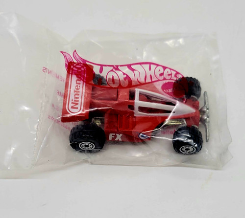 Mattel 1991 Hot Wheels 1/64 Nintendo FX Race Car, red race car toy inside clear plastic packaging with Hot Wheels logo.