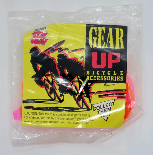 Wendy's Kids' Meal Toy 1992 Gear Up Bicycle Accessories - Handlebar Streamers, pink and orange handlebar streamers inside clear plastic packaging with black and yellow graphic label.