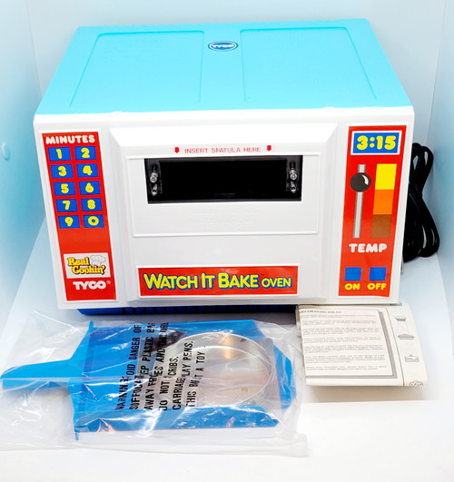Tyco TYCO 1990 Real Cookin' Watch It Bake Oven, vintage children's toy oven with colorful controls, digital timer, and temperature settings.