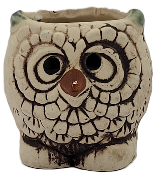 Vintage ivory ceramic owl candlestick holder with large black eyes and brown feather details