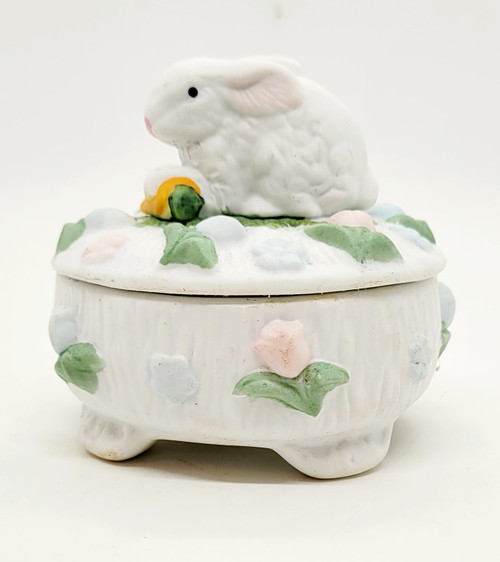 McCrory Easter Bunny with Carrot Ceramic Trinket Box, white bunny figurine with pink ears sitting on a decorated base with pastel flowers and leaves.